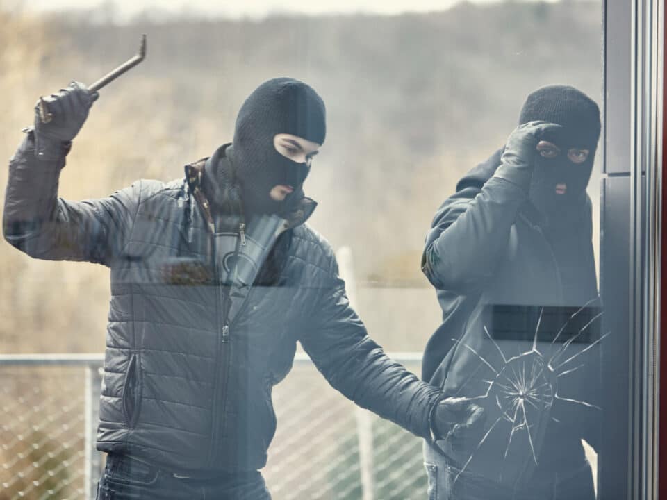 Intruders breaking a glass door