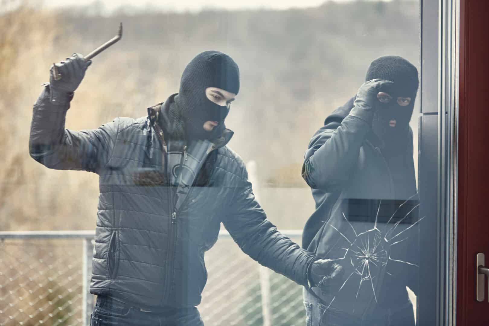 Intruders breaking a glass door